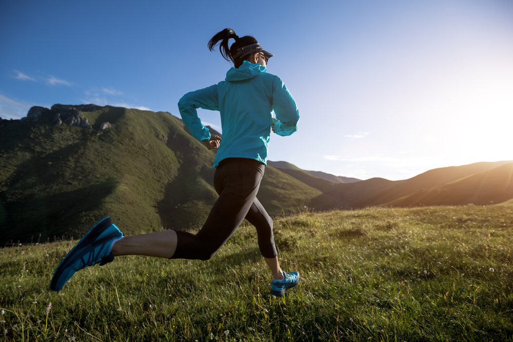 Young,Woman,Ultramarathon,Runner,Running,At,Mountain,Top - Relax